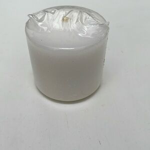 White Candle 2”across 3” tall new in protective wrapper.
